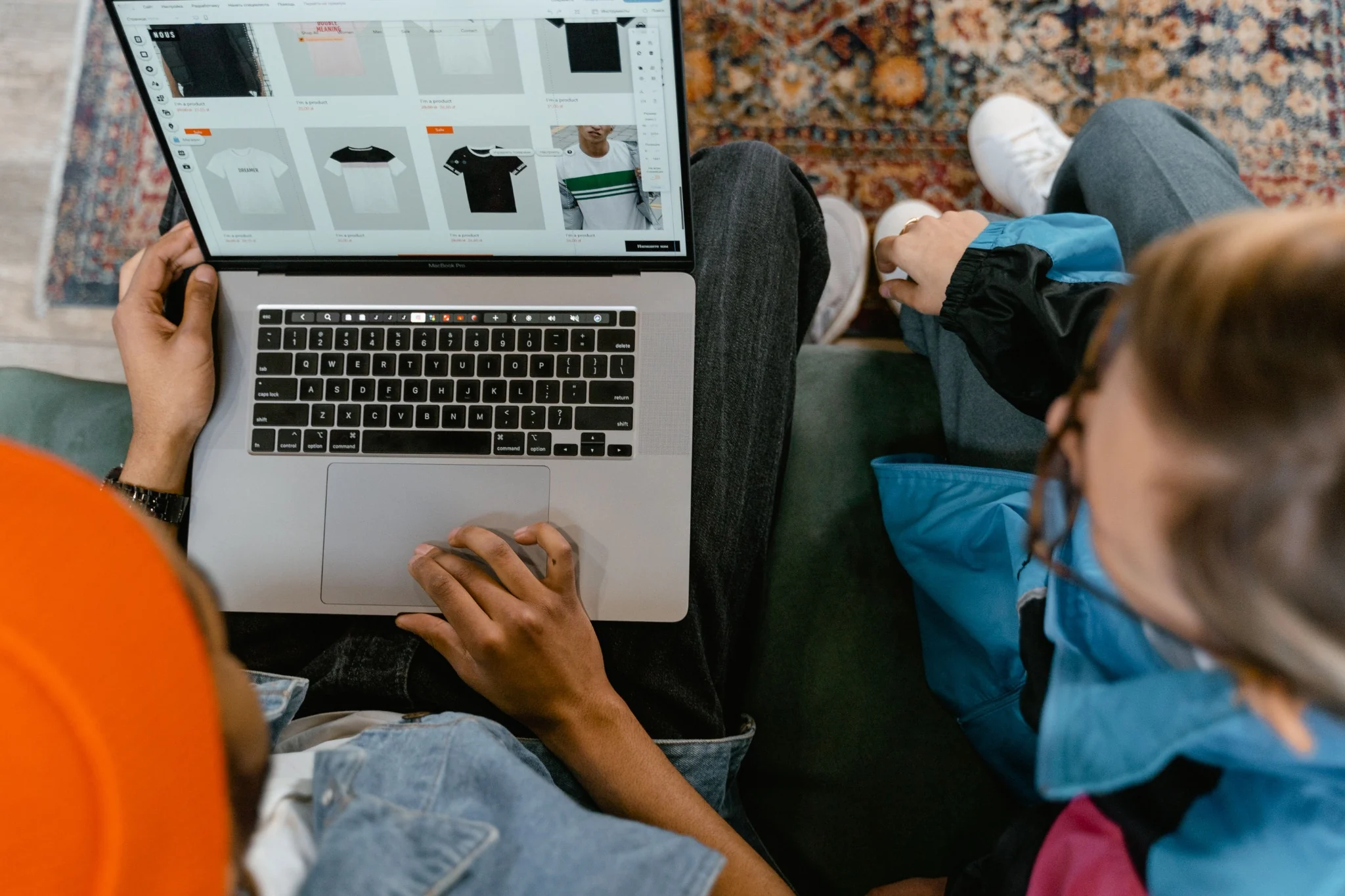 Two people browsing product options on a laptop.